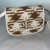 m_wp_65527abf678c3a537a0ee12e Tory Burch Britten Woven Small Saddle Bag