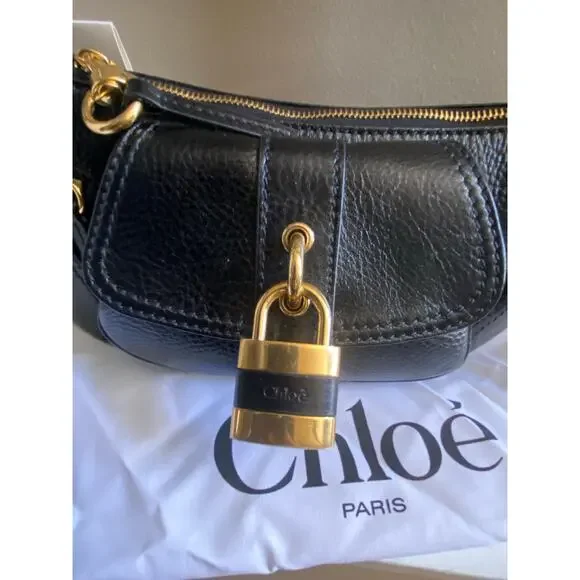 m_wp_697ea28b5df8e7623fea1ed6 Chloé The 99 Leather Shoulder Bag - Black with Gold Padlock
